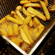 French fries are prepared at 'BurgerArt' restaurant in Berlin